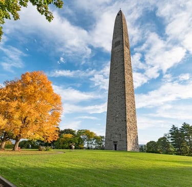 Bennington Battle Monument viewed across a green field