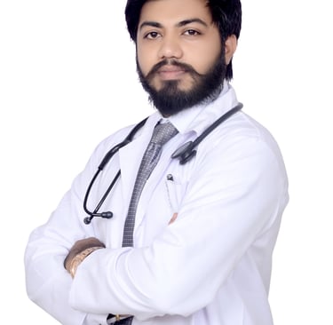 Professional male doctor with a beard wearing a white lab coat and stethoscope against a white background.