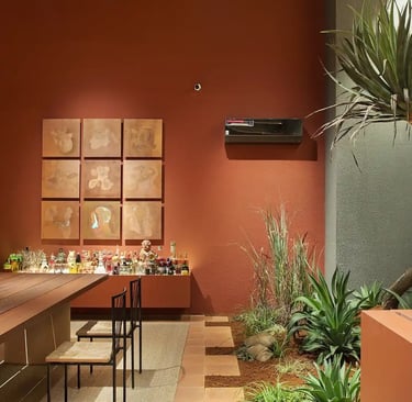 a dining room with a bar, table and chairs