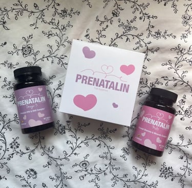 Prenatalin prenatal vitamins and Omega-3 DHA supplements box and bottles on a floral background.