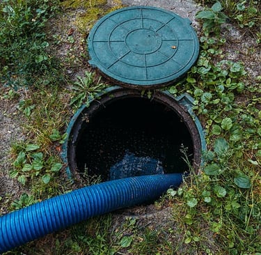 hose pumping out a septic tank