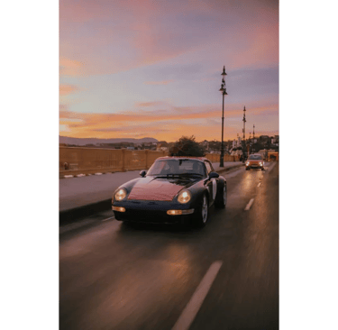 Luxury sports car driving at sunset on Atal Setu Mumbai
