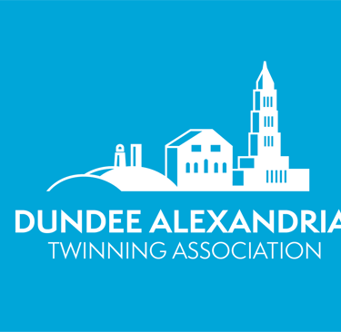 Dundee Alexandria Twinning Association logo featuring a white cityscape silhouette on a blue background.