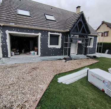 a house with a garage door and a garage door