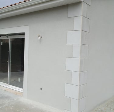 a house with a large window and a patio with a patio