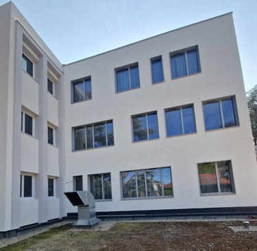 a building with a large window and a sculpture of a sculpture