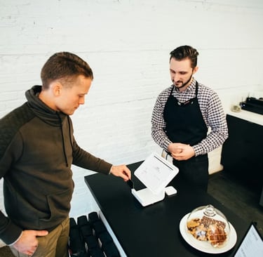 Tablet screen with financial charts and bar graphs, showing the growth of online auto parts and filter sales