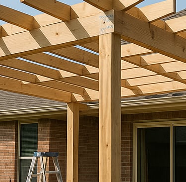 Pergola framing in progress over a residential backyard patio