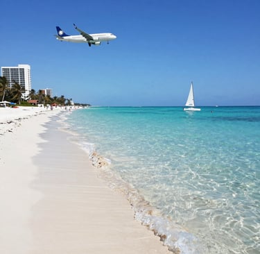 A vibrant beach scene with turquoise Caribbean waters and palm trees swaying under a clear blue sky.