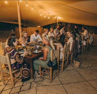 a group of people sitting around a table
