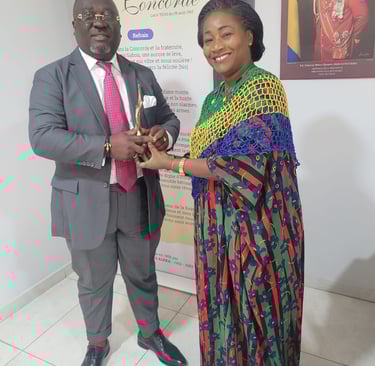 a man and woman standing next to a poster