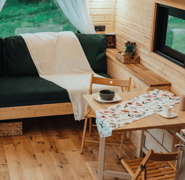 Tiny House living room with green sofa