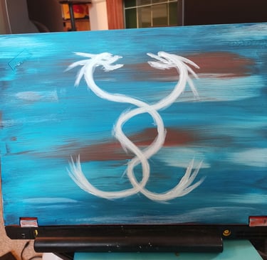 twin dragon on the back of a laptop