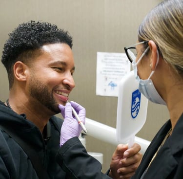 Dentist reviewing dental results with Invisalign during a consultation in Rego Park,  New York