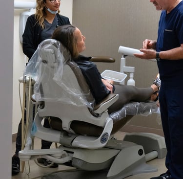 orthodontist consulting with a patient during a dental visit