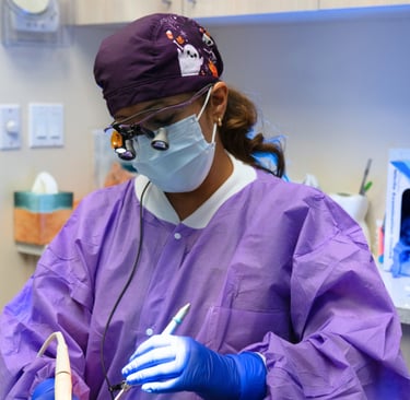 dental hygienist performing a deep cleaning procedure with clinical precision