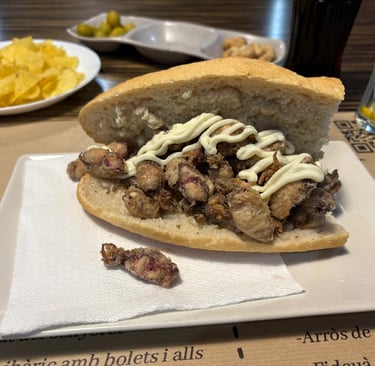 Traditional Spanish bocadillo sandwich with crispy fried baby squid and aioli mayonnaise.