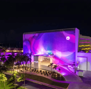 Temptation resort at night front view