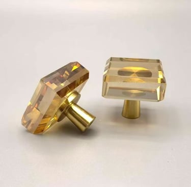 Amber square crystal cabinet knobs with brushed gold hardware for luxury home decor.