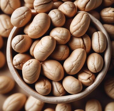 Freshly roasted peanuts being ground into smooth peanut butter in a rustic stone mill.