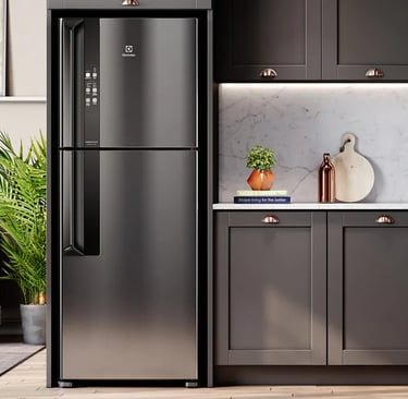 a kitchen with a refrigerator and a couch
