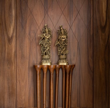 Custom wooden wall panel with decorative brass statues - Amuk Modular interior design Pune