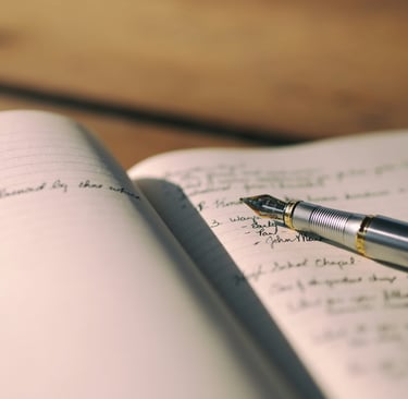 Fountain pen on a journal by Aaron Burden