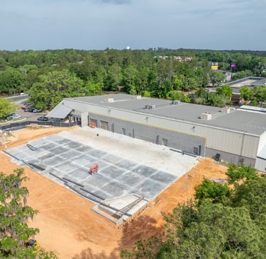 a large building with a poured foundation for a new building under construction