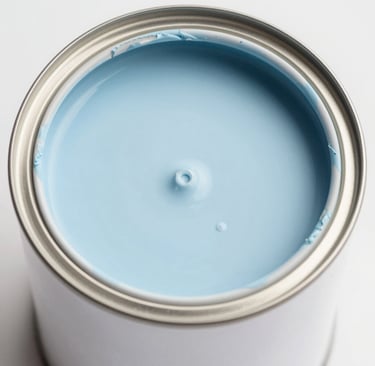 A cozy studio corner with paintings drying and art supplies scattered around.