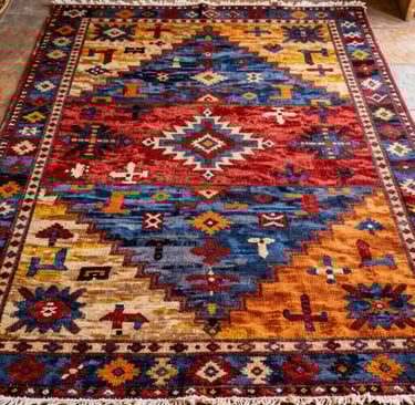 A terracotta-hued Azilal rug with intricate tribal motifs displayed on a minimalist wooden floor.