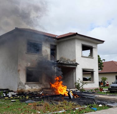 Technician inspecting a roof after storm damage with safety gear.
