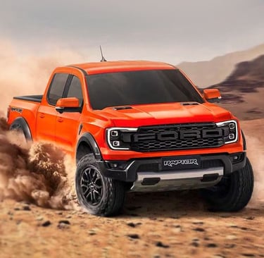 Orange Ford F-150 Raptor performance truck driving through desert sand dunes off-road.