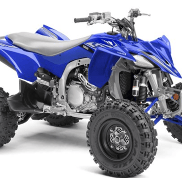 Blue Yamaha YFZ450R sport ATV with knobby tires and racing suspension on a white background.