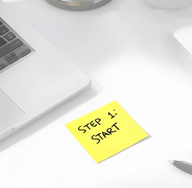 a laptop computer and a keyboard on a desk