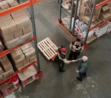 Warehouse operations with workers managing inventory and logistics for supply chain support