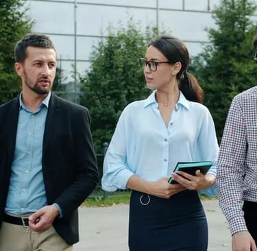 Corporate professionals discussing business expansion and sales execution strategies outdoors