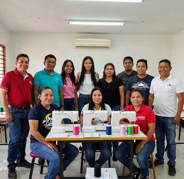 A diverse textile production team working together, representing ethical supply chains in a bright, modern workshop.