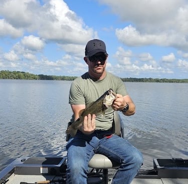 Matt holding a Large Mouth Bass