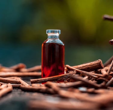 Manjistha roots with a bottle of red extract on a natural background representing the Ayurvedic herb