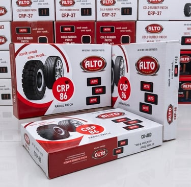 Stacked boxes of Alto CRP-86 radial patches and CRP-37 cold rubber patches for tire repair.