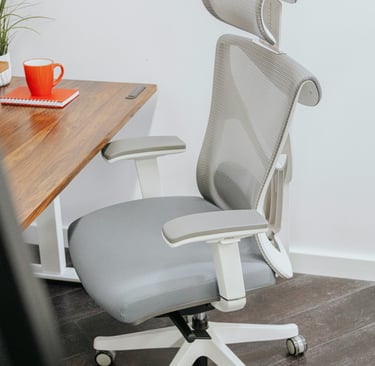 a ergonomic office chair with a cup of coffee and a cup of coffee