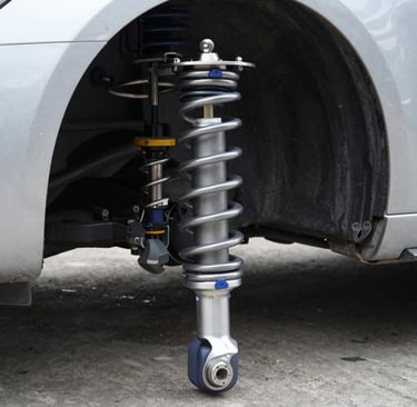 Car tire being inflated with a portable inflator in the garage