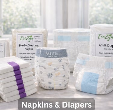 Eco-friendly bamboo sanitary napkins and Millie Moon baby diapers arranged on a table.