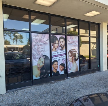 a storefront door with a large window with a vinyl application perforated