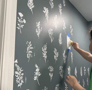 Kid helping with home DIY project: Wall Stenciling