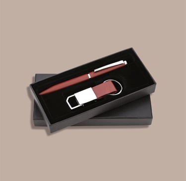 New joinee kit featuring a premium pen and leatherette keychain in a minimalist box.