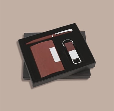 Minimalist employee new joinee kit with a pocket diary, matching pen, and keychain.