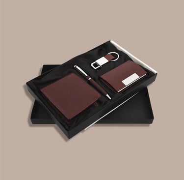 Executive onboarding new joinee kit including a cardholder, wallet, pen, and keychain.
