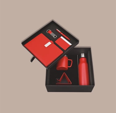 Employee new joinee kit mega hamper with a red bottle, mug, tech stand, and notebook.