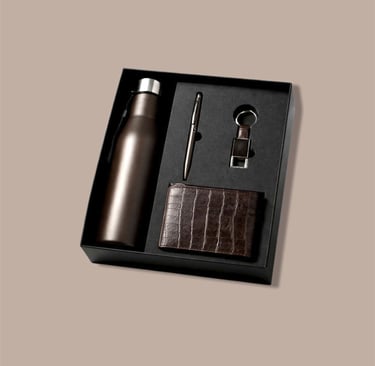 All-brown new joinee kit with a matte flask, textured wallet, and minimalist pen.